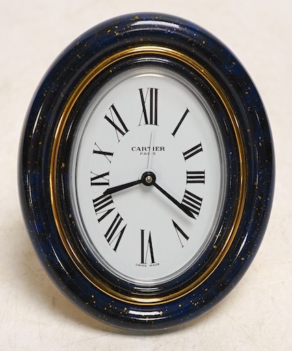 A modern Cartier gilt metal quartz travelling clock. 9cm. Condition - good, not tested as working